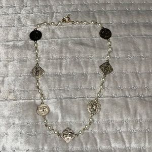 Beautiful chain with white pearls brand new size is 22”long.